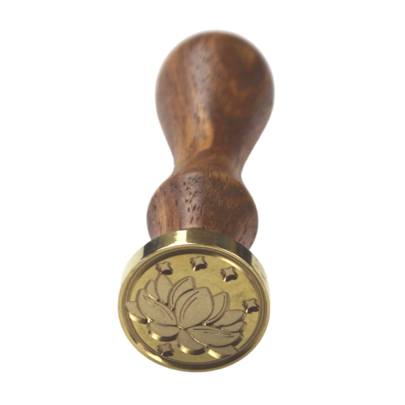 Brass wax seal stamp of a lotus flower on a wooden handle