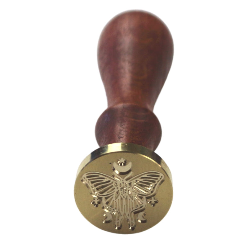 Brass wax seal stamp of a lunar moth on a wooden handle