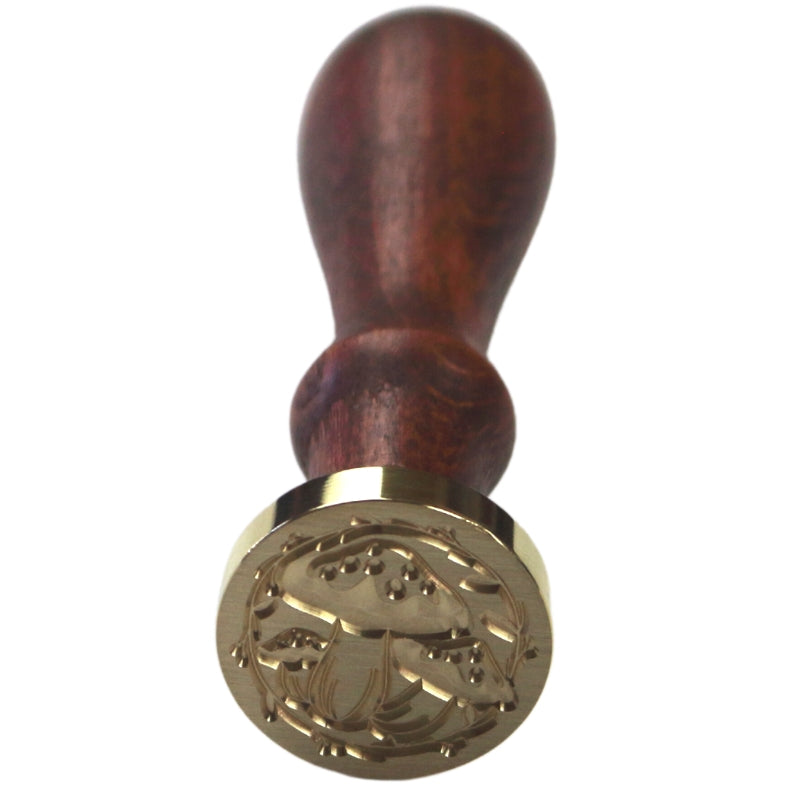 Brass wax seal stamp of 3 mushrooms on a wooden handle