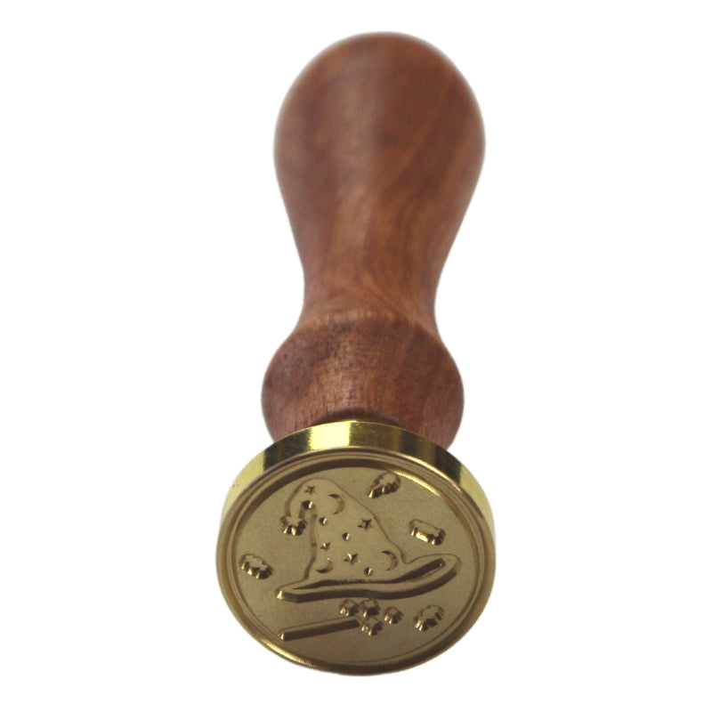 Brass wax seal stamp of a witches hat and wand  on a wooden handle