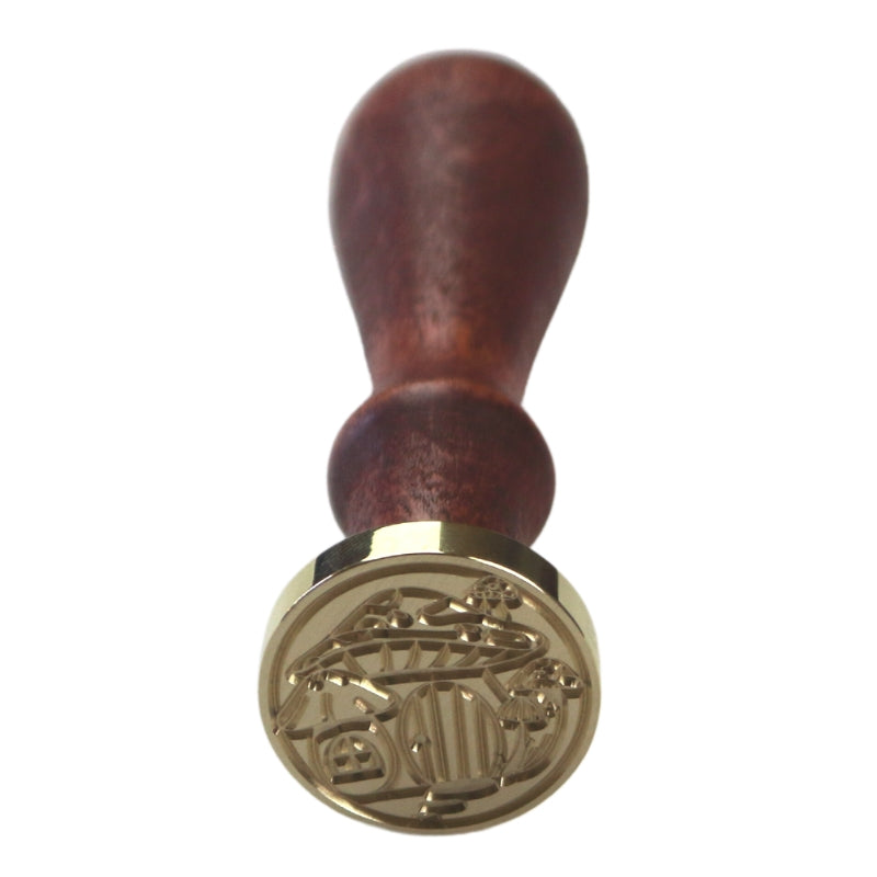 Brass wax seal stamp of a fairy door mushroom on a wooden handle