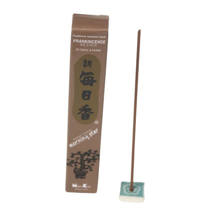 rectangle box of japanese morning star "frankincense" incense sticks next to a tile incense holder