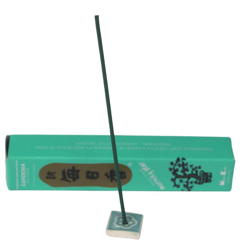 rectangle box of japanese morning star "gardenia" incense sticks next to a tile incense holder 