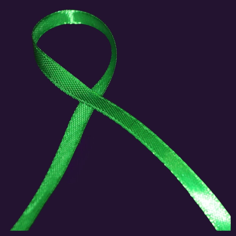 Green ribbon on purple background 