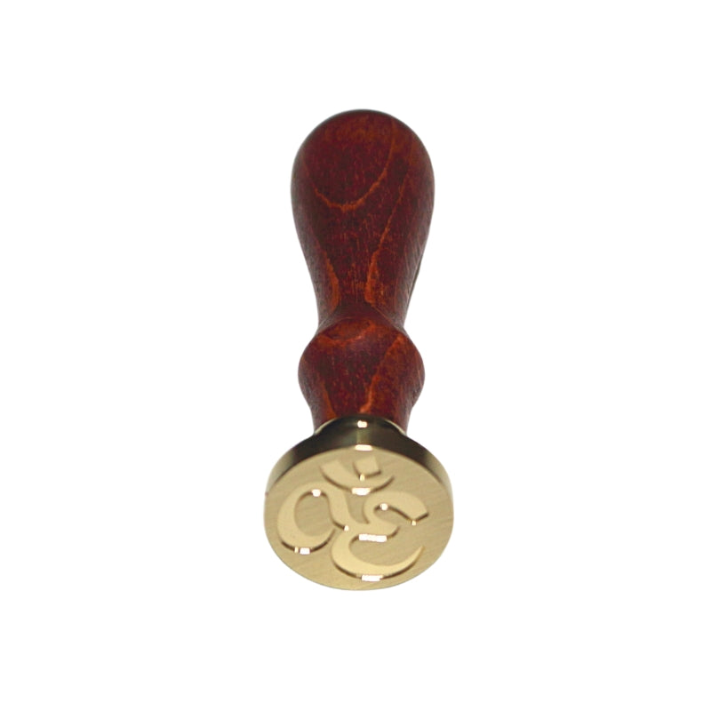Brass wax seal stamp of the "om symbol" on a wooden handle