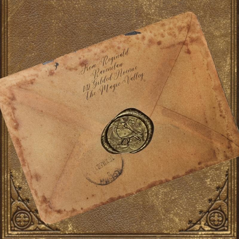 gold wax seal of a raven on an old letter, sitting on an old book