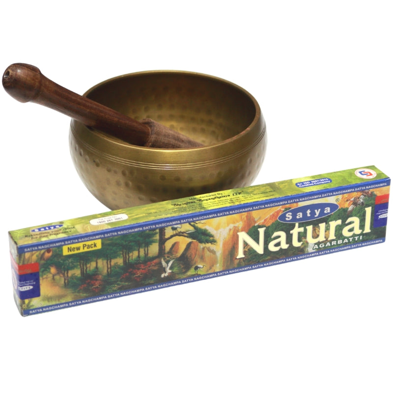 green box- satya brand "natural" incense in front of brass singing bowl with wooden striker