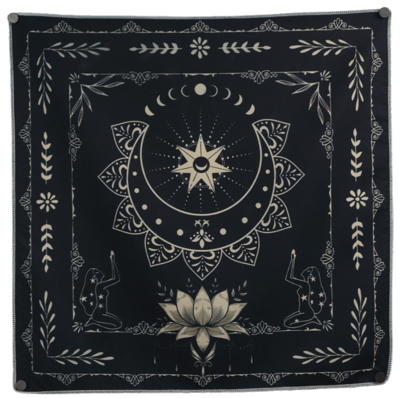 Black and white tarot cloth embellished with a lotus flower and an upturned  crescent moon