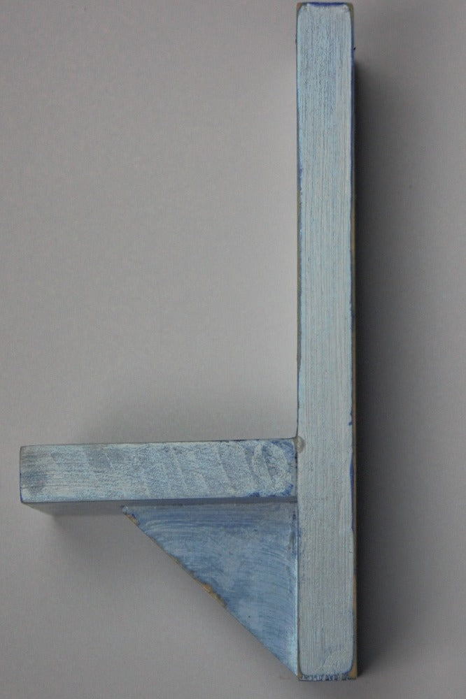 distressed blue and white wooden wall mounted candle or ornament shelf  side view